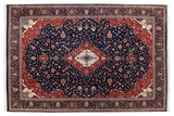 Vintage Indian Kashan design carpet with a navy blue field, central medallion, and red floral spandrels.
