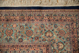 Vintage Indian Ardebil rug corner, dense floral field, blush borders, ivory fringe.