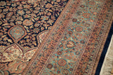 Vintage Ardebil rug: intricate floral patterns on navy, ivory spandrel, and pale sea foam fields.