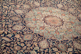 Vintage Indian Ardebil design carpet with detailed thousand flower motif in navy, blush, and ivory.