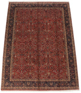 Angled view of a vintage Agra carpet showing the brick red field with repeating Samovar design motifs.