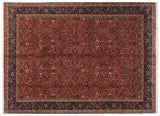 Shadow-outlined Samovar motifs and arabesques hand-knotted on the vintage Agra carpet's brick red field.