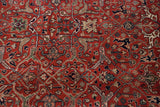 Shadow outlined Samovar design in slate blue and sand on the carpet's full brick red pile.