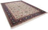 Vintage Agra carpet viewed from an angle, highlighting the navy border and scrolling floral field.