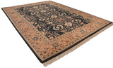 Vintage Pakistani rug corner with terracotta border, serrated leaf floral vines, navy field, and fringe.