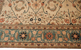 Wide dusty mallard green border of vintage Pakistani rug with floral and serrated leaf design.