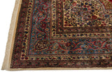 Corner of a vintage Persian Kerman showing the elaborate borders and original full wool pile.