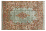 Vintage Persian Kerman carpet with a floral medallion and Rococo designs on a dusty seafoam blue field.