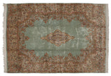 Vintage Kerman rug with an open seafoam blue field, floral sprays, and a Rococo-style medallion.