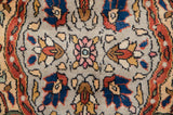 Crisp detail of arabesque floral motifs in blush, indigo, and terracotta rust.