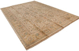 Vintage Agra carpet corner with scrolling palmettes, muted green, and fringe.