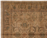 Fringed corner of a vintage Agra carpet with scrolling leaves, palmettes, and subtle abrashes.
