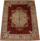 Perspective view of the Savonnerie carpet's red field and slate blue floral border.