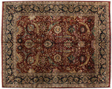 Scrolling saffron and blue floral vinery on the cherry red field of a vintage Isfahan carpet.