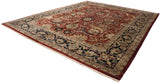 Angled view of a vintage Isfahan carpet showcasing its intricate Safavid-style floral vinery.