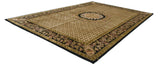 Indian Savonnerie carpet with a black floral border contrasting against a golden geometric field.