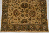 Vintage Indian Sultanabad carpet's olive green border, terracotta florals, and detailed ivory field vinery.
