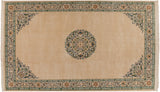 Corner spandrels that echo the central medallion's design on a vintage Japanese Peking carpet.