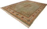 Vintage Japanese Peking carpet corner: sage green, pale gold, and red floral scrolling vine border.