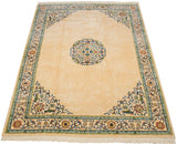 Vintage Peking design carpet from an angle, showcasing the plush ivory pile and floral medallion.