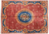 Gold Rococo-inspired corner cartouche and blue floral border on a dusty raspberry field.