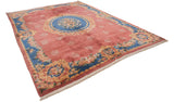 Angled perspective of a vintage Japanese carpet with a Rococo floral medallion and sky blue border.