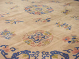 Japanese Peking style carpet, ivory field with blue curvilinear border and blush floral details.