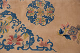 Vintage Peking rug: ivory field, cobalt blue vines, and blush floral motifs.