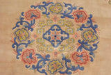 Intricate cobalt blue vines, blush florals, and gold geometric pattern on a Peking rug.