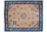 Vintage Japanese Peking carpet with ivory field, cobalt blue border, roundel medallion, and scattered pink, blue florals, 12x15.