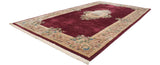 Intricate Japanese Savonnerie carpet, black cherry red field, rose bouquet medallion, scrolling vinery border.