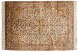 Vintage Bulgarian Isfahan carpet with a diamond medallion and dense floral arabesques on an ivory ground.