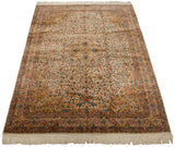 Angled view of a vintage Bulgarian Isfahan carpet showing its full floral pattern and central medallion.