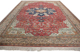 Angled perspective of a vintage Kaisary carpet, highlighting the brick red field and central medallion.