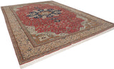 Angled view of a vintage Kaisary carpet highlighting its formal starburst medallion and floral border.