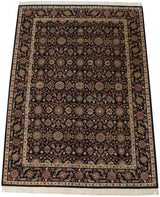 Vintage Agra carpet corner featuring ivory floral border and black field palmettes.