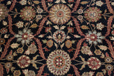 Black field of the vintage Agra carpet featuring wine red, gold, and olive floral palmettes.