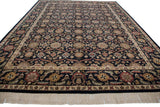 Light fringe and ornate floral border of vintage Agra carpet in black, ivory, wine, gold.