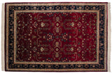 Indian Mohajeran Sarouk carpet with an allover floral design, black cherry red field, and navy blue border.