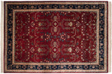 Classic Mohajeran Sarouk style showing germinating plants and vinery on a cherry red and navy blue field.