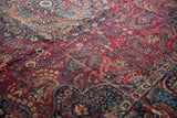 A close-up view of the even, hand-knotted pile of a vintage Tabriz carpet.