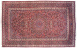 Symmetrical layout of the vintage Meshed carpet, featuring a central medallion and intricate floral borders.