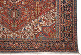 Vintage Bakshaish carpet corner with geometric serrated leaves, flower motifs, and layered borders.