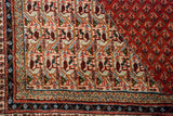 Vintage Mir Sarouk carpet's ivory field with repeating detailed botehs and patterned multi-color border.