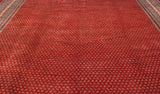 Cherry red field of Persian Mir Sarouk carpet with repeating diminutive detailed boteh motifs.