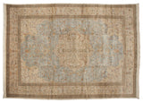 Vintage Tabriz rug showing the ornate, ivory quatrefoil medallion and complementary corner spandrels.