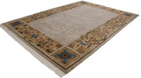 Indian Savonnerie design carpet with a shadow floral beige field and ornate scrolling border.