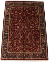 Hand-knotted Indian Mohajeran Sarouk with deep wine red field and ornate navy floral borders.