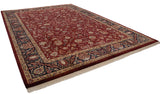 Intricate navy blue border, antique ivory floral details, rich wine red field, and light fringe.