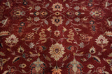 Rich wine red field with scrolling floral tendrils in navy, ivory, and copper.